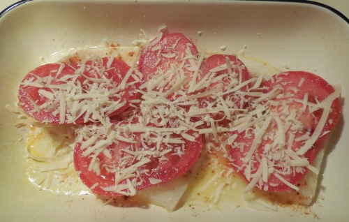 Add tomatoes and cheese and it's ready to bake