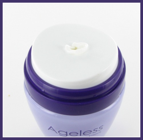Ageless face cream dispenser in a purple jar.