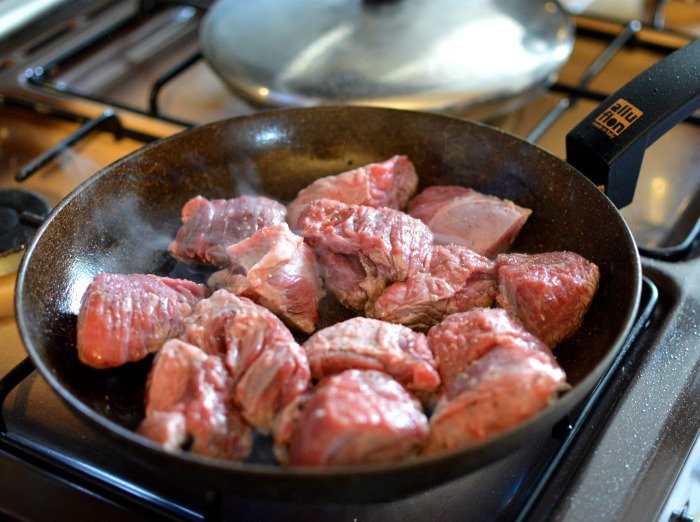 Browning meat in a sauce pan