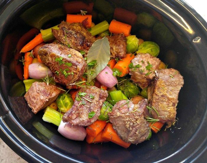 Layer a crock pot with the slowest cooking ingredients on the bottom