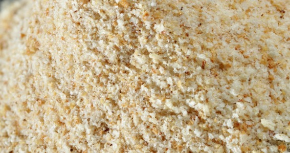 Grate stale bread for breadcrumbs