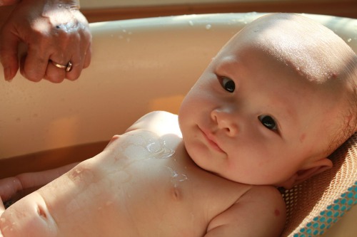 Add coconut oil to the baby's bath water