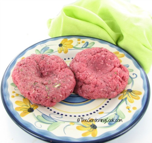 Indentations in a burger patty make sure they will not crack when cooking.