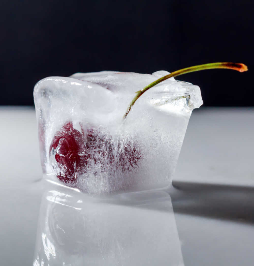 Cherry frozen in a large ice cube