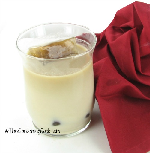 iced coffee in a glass with a red napkin.