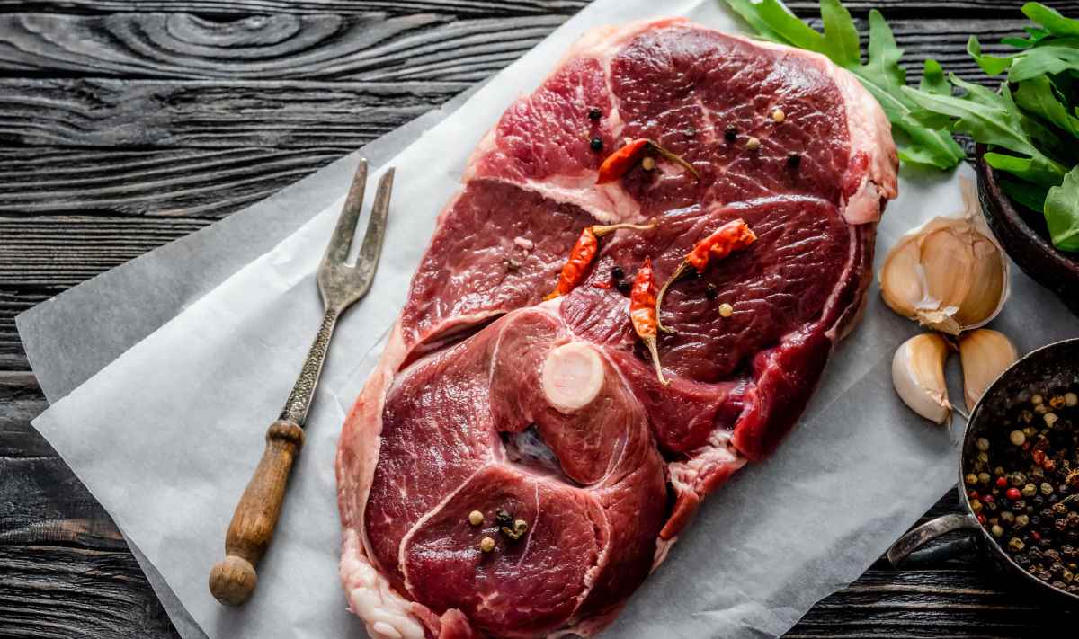 Room temperature meat with spices and a fork.