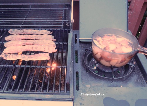potatoes and bacon cooking on the grill