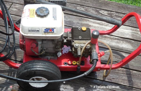 Gas power washer on a deck.