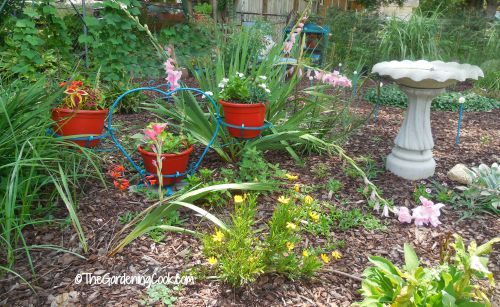 nostalgic items add appeal to a garden bed