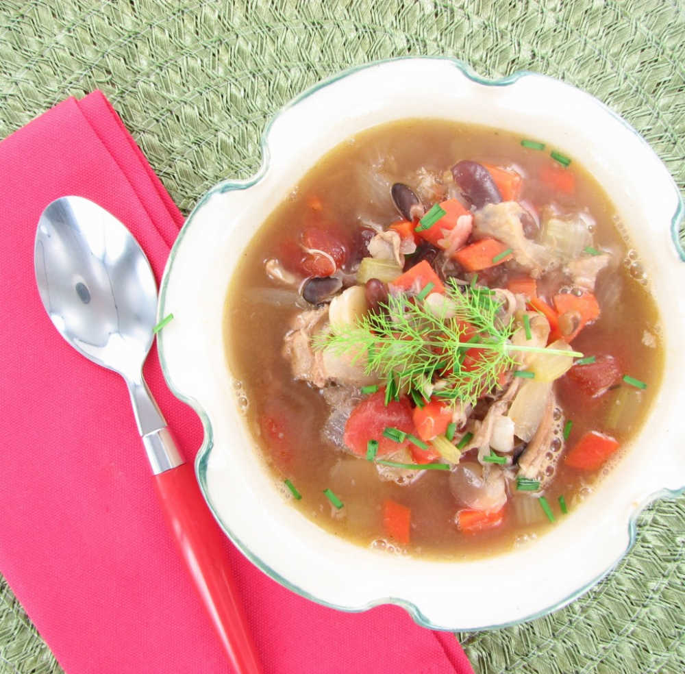 Chicken Taco Soup in a bowl with a pink napkin and spoon.