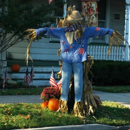 Scare crow and bales of hay