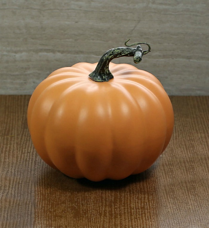 Faux pumpkin with a long stem,