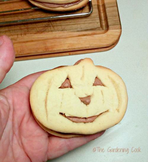 Halloween Pumpkin cookie with frosting inside.