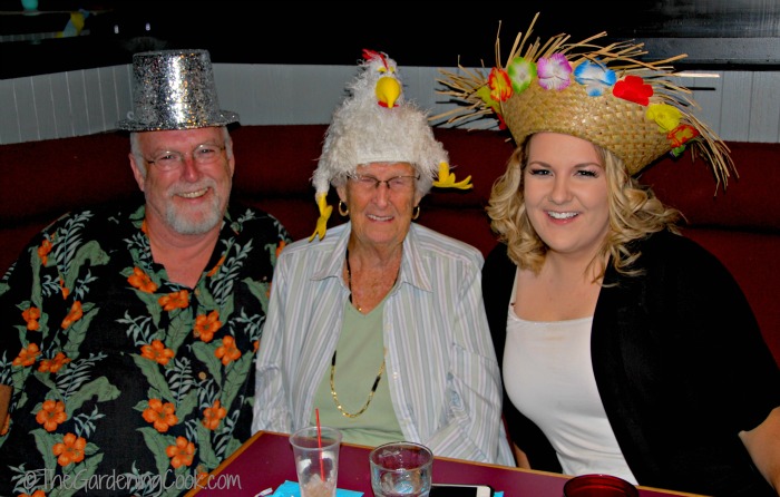 My mother in a chicken hat - with my brother and niece.