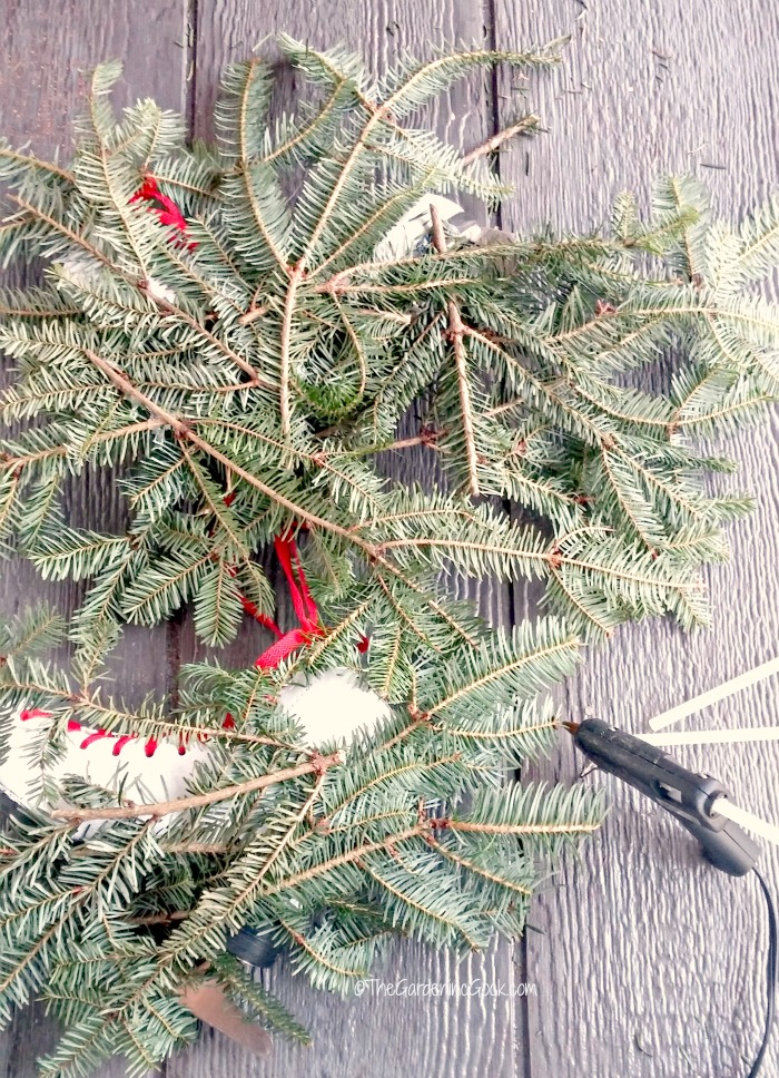 hot glued fir boughs on skates