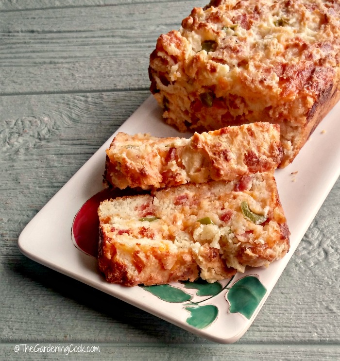 Slices of Bacon jalapeno cheese bread on a flowered plate.