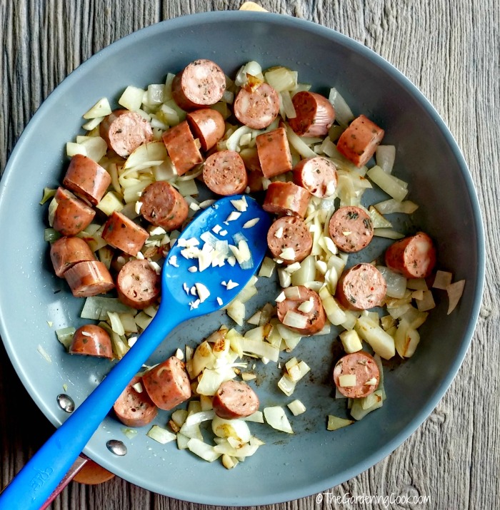 add sausages to onions