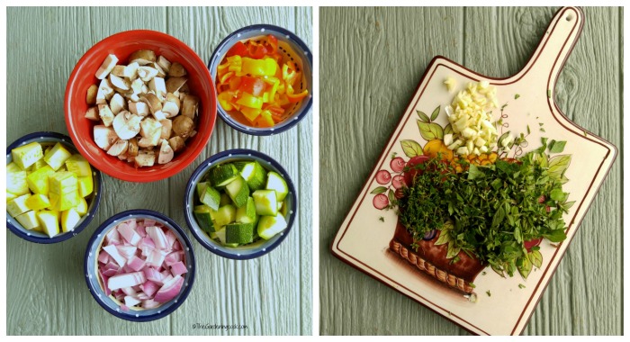 Chopped vegetables and herbs in bowls and on a cutting board.
