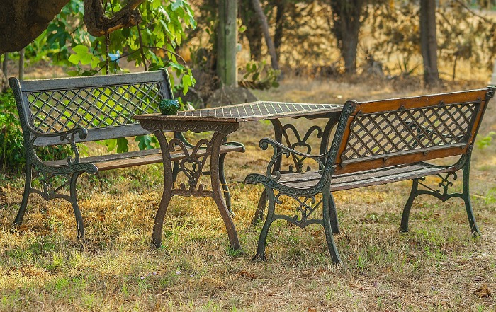 Matching garden benches make an eating area