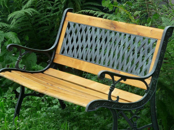 Metal backed garden bench