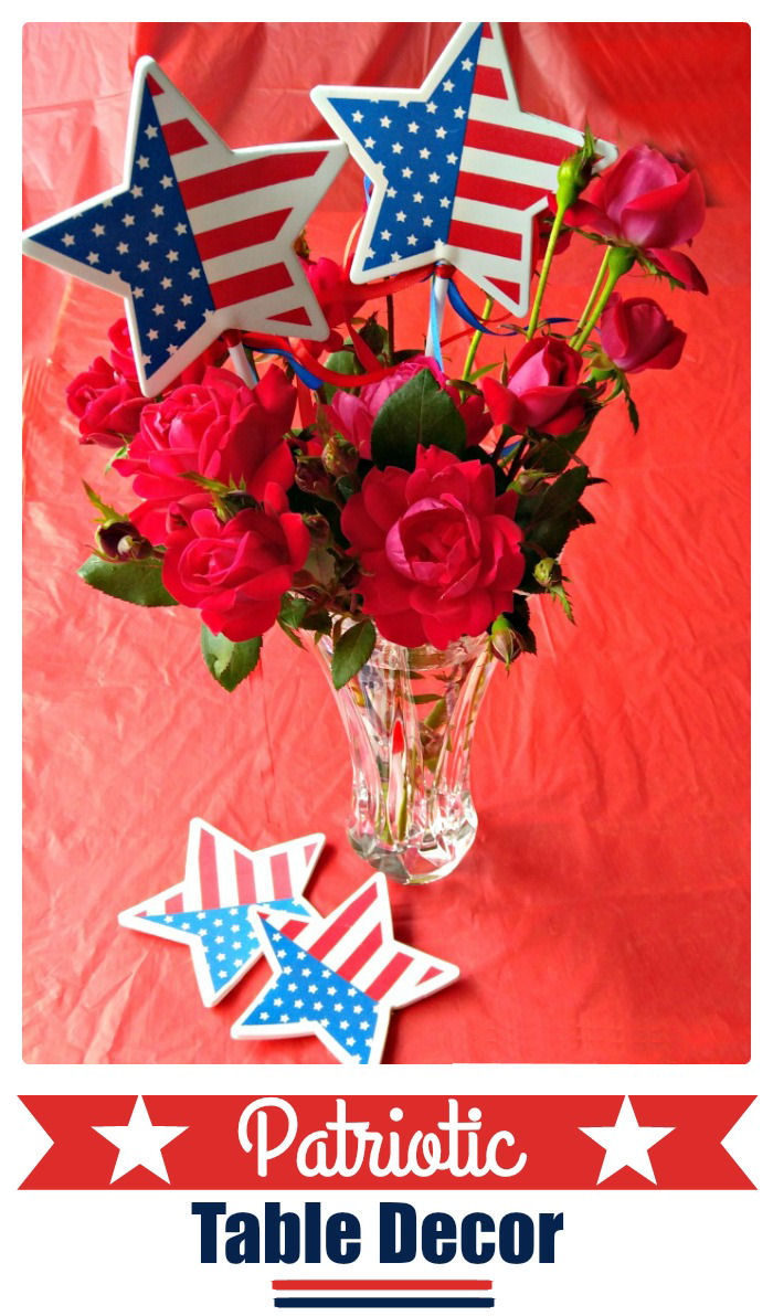 Flowers in a vase with flag stars and words reading Patriotic Table Decor.