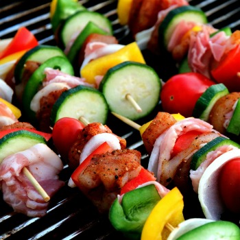 Vegetables on skewers on a grill pan.