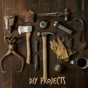 Tools and gloves with words DIY projects.