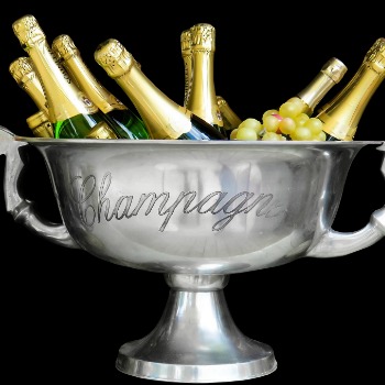 Silver bowl with bottles of champagne.