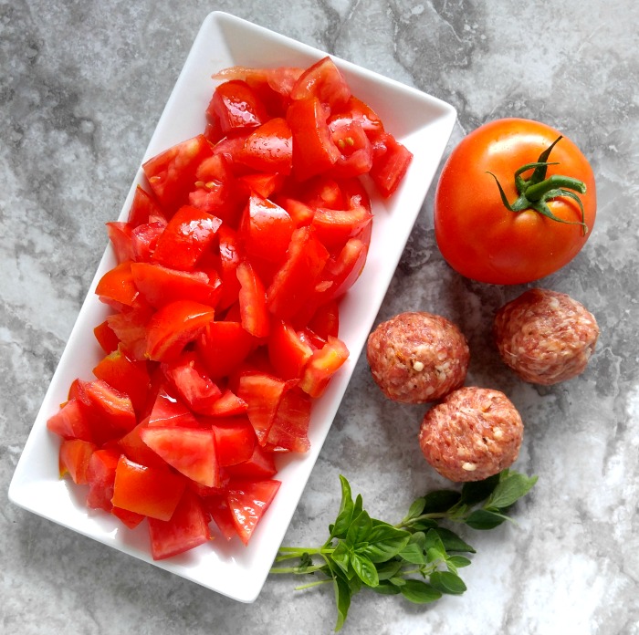 Seeded tomatoes abruzzese meatballs and herbs