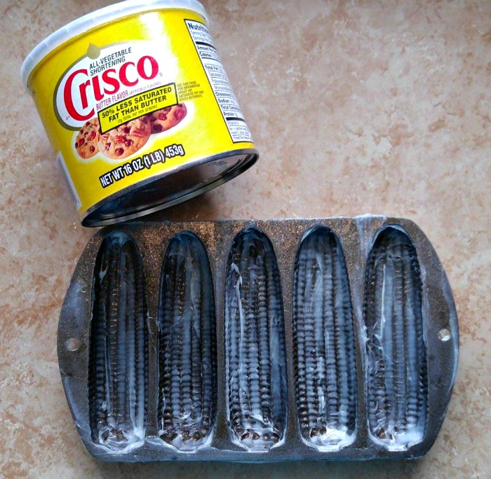 LIberally coat the cast iron with shortening