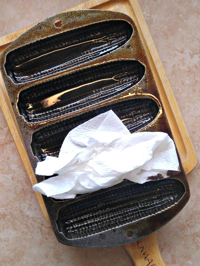 Wipe out the excess shortening with paper towels