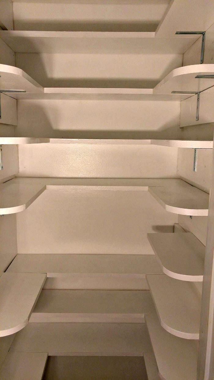 The pantry shelving is competed