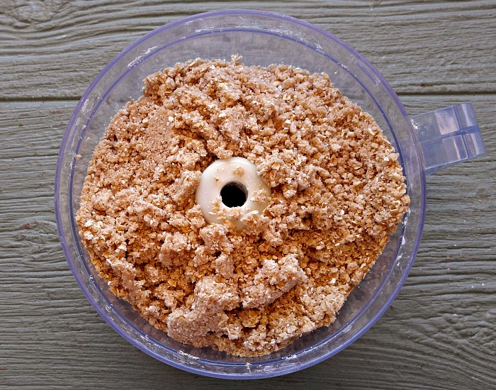 Oats, flour and butter in a food processor.