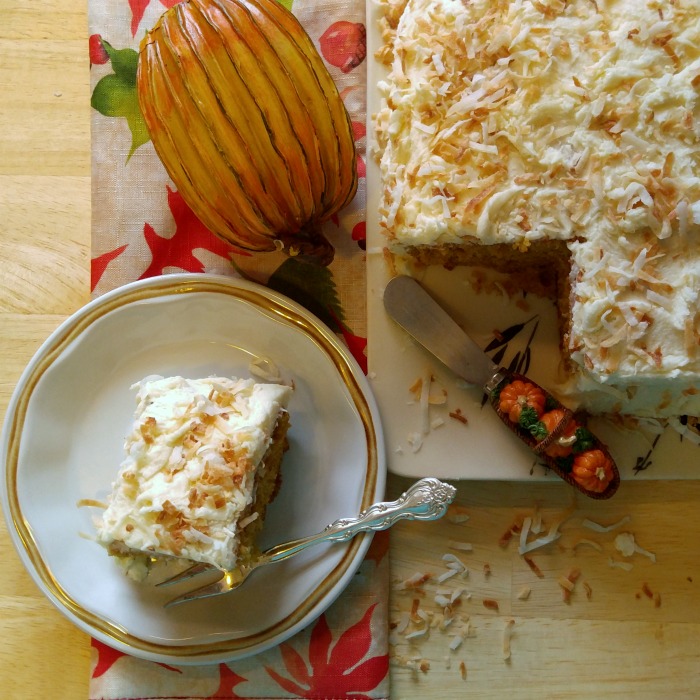Faux pumpkin and slice of cake cut from a larger cake.