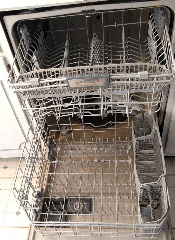 Empty dishwasher with the door open.