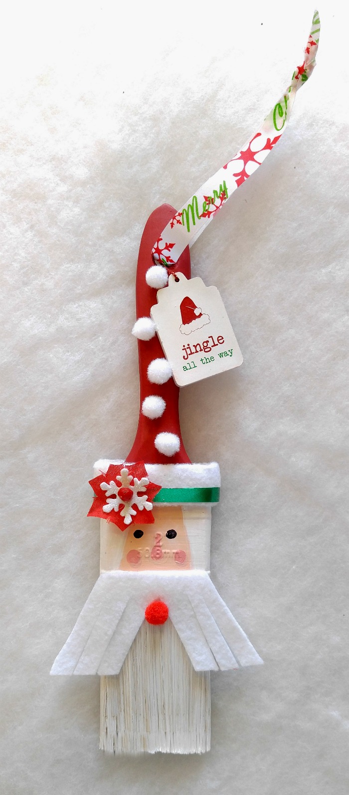 This Santa Claus Paintbrush decoration is whimsical and fun to make and will look cute on a Christmas tree or as a wall hanging.
