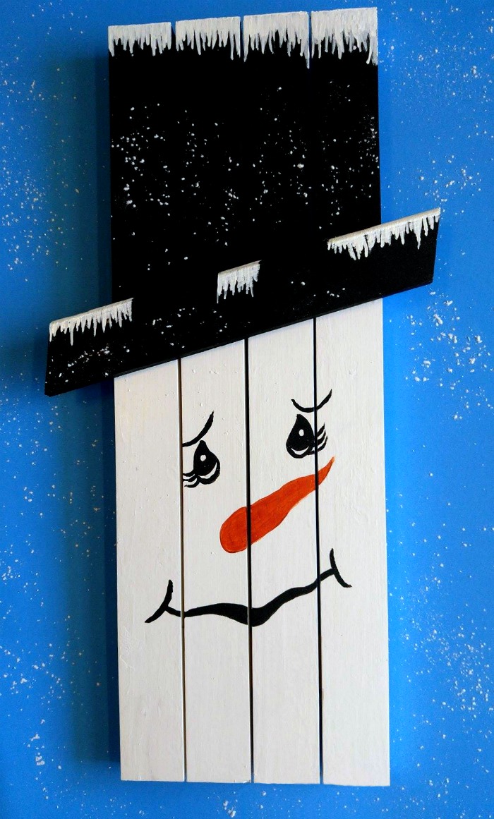 This cute snowman wall hanging was made from a old kitchen door frame. He is easy to do and looks great hanging on a wall.
