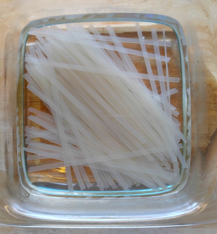 Soften rice noodles in very hot water