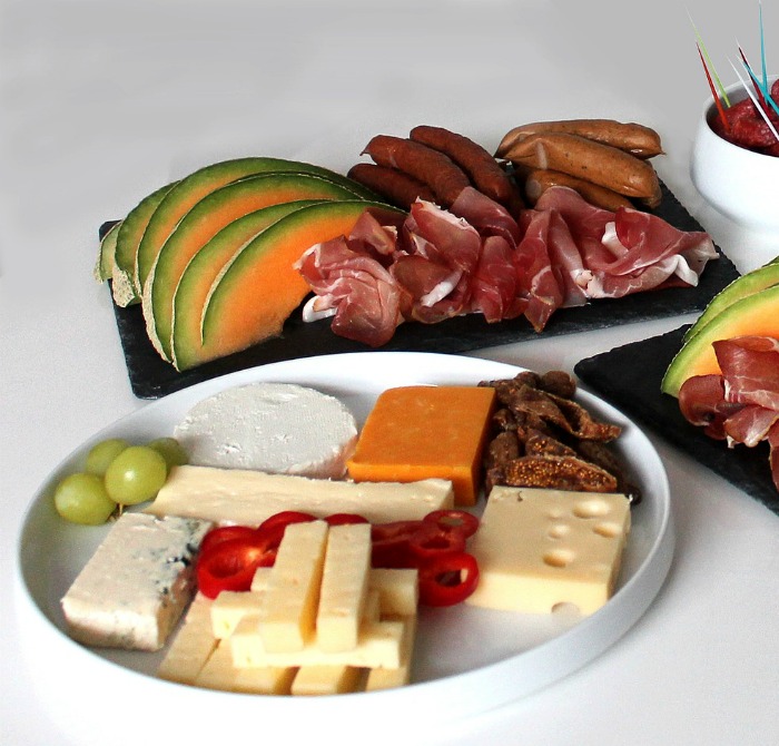 antipasto platters with cold meats and cheese.