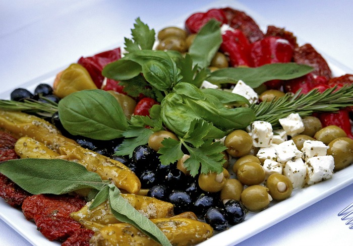 Antipasto vegetables, olives and cheese.