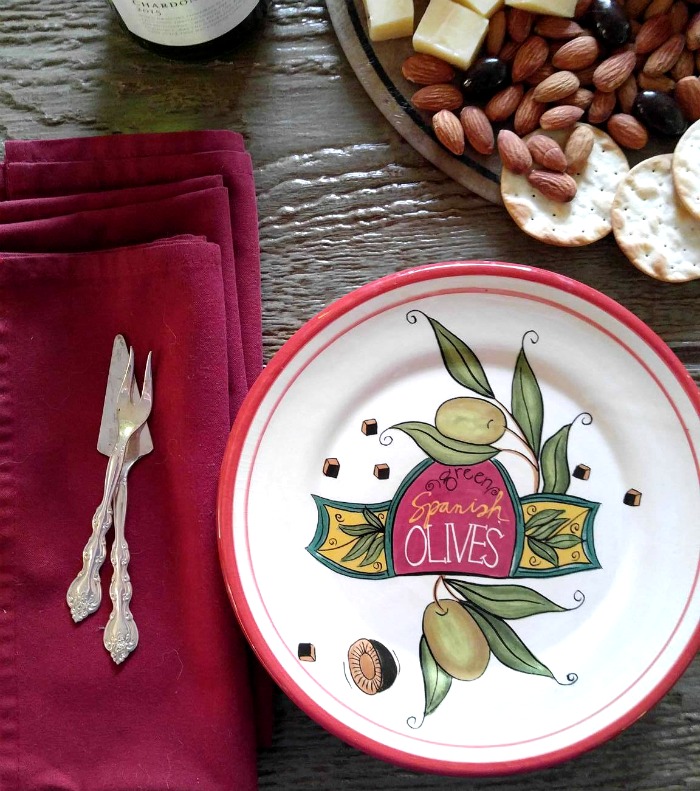 Specialty appetizer plate with silverware and red napkin
