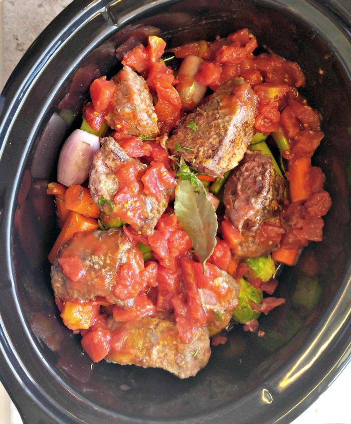 Pour over the beef stock and diced tomatoes
