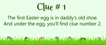 Easter eggs in grass with a clue for finding the first Easter egg.