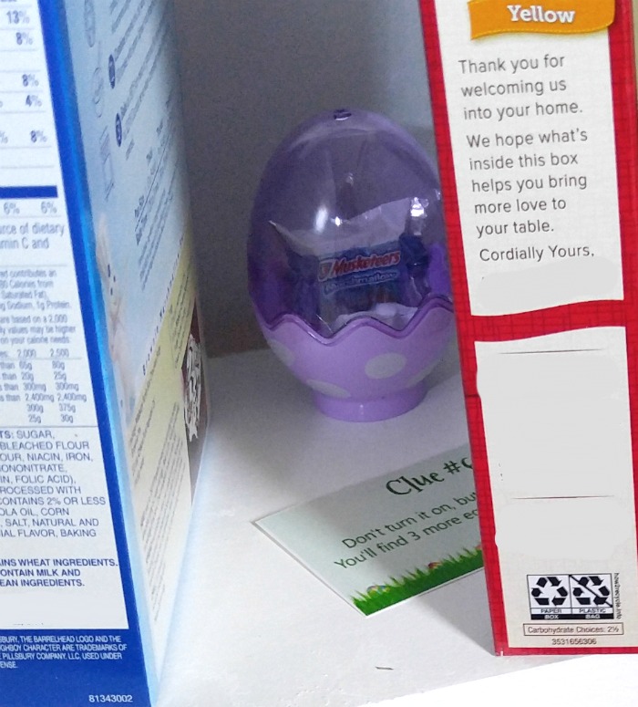 Purple plastic Easter egg between two cake mixes.