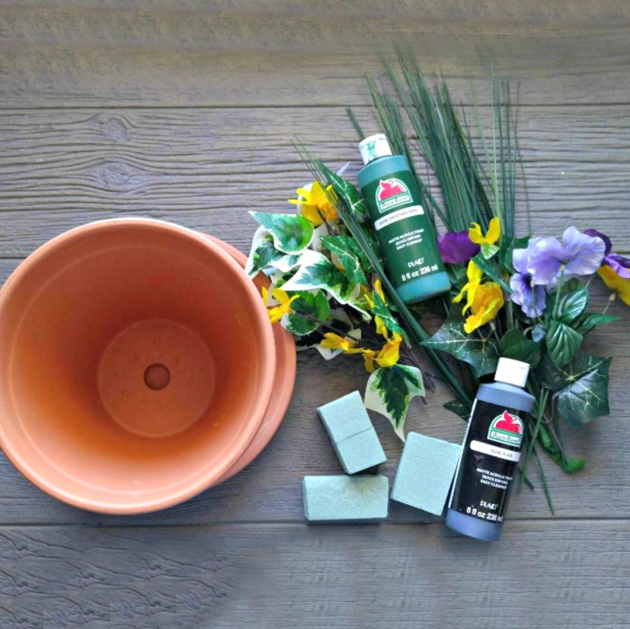 Supplies for the St. Patricks' Day Centerpiece - floral foam, silk flowers, clay pots, acrylic paint.