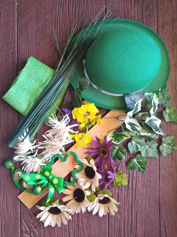 Leprechaun hat, flowers, shamrocks, leaves and plywood.