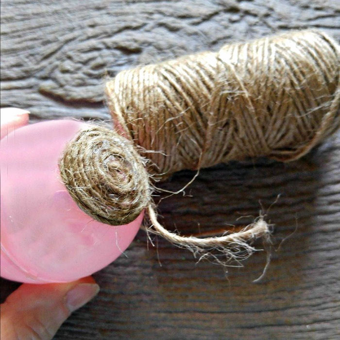 Hot glue the rope to the top of the egg