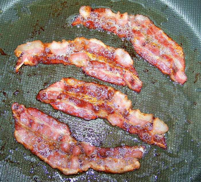 Cook the bacon and drain the fat