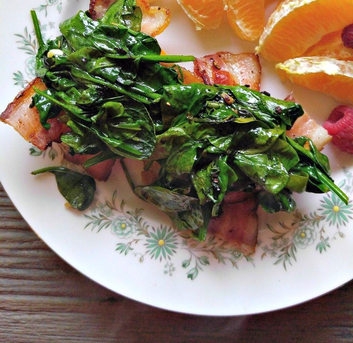 Add the bacon and spinach layers on the sweet potato rounds