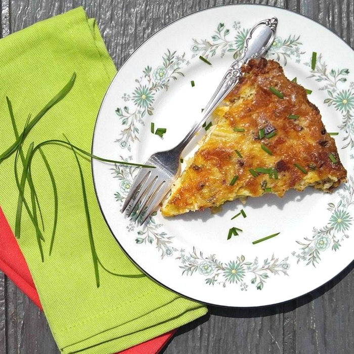 Slice of quiche with colorful napkins This chicken quiche no crust recipe is gluten free!